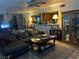 Living room with sectional sofa, coffee table, and built-in shelving at 2686 Ruthe Duarte Ave, Las Vegas, NV 89121