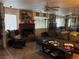 Living room with fireplace, sectional sofa, and wood rocking chair at 2686 Ruthe Duarte Ave, Las Vegas, NV 89121