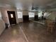 Spacious living room with brick fireplace, tile floors, and large mirrored wall at 2686 Ruthe Duarte Ave, Las Vegas, NV 89121