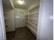 Spacious pantry area with ample shelving and tiled flooring for organized storage at 2686 Ruthe Duarte Ave, Las Vegas, NV 89121