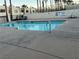 Community pool with patio tables and chairs at 2686 Ruthe Duarte Ave, Las Vegas, NV 89121