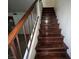 Wood staircase with railings leading to the upper level of the home at 2686 Ruthe Duarte Ave, Las Vegas, NV 89121