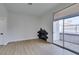 Modern living room with fireplace, sliding door to balcony, and kitchen at 3150 Soft Breezes Dr # 2191, Las Vegas, NV 89128