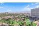 Aerial view showcasing expansive golf course and distant mountains at 322 Karen Ave # 1903, Las Vegas, NV 89109