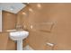 Small powder room with pedestal sink and neutral tones at 322 Karen Ave # 1903, Las Vegas, NV 89109