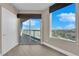 Bedroom with balcony access and city views at 322 Karen Ave # 1903, Las Vegas, NV 89109