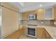Modern kitchen with stainless steel appliances and wood cabinets at 322 Karen Ave # 1903, Las Vegas, NV 89109