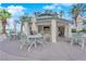 Relaxing poolside space with tables, chairs, and a shaded bar at 322 Karen Ave # 1903, Las Vegas, NV 89109