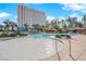 Resort-style pool with a waterfall feature and plenty of space for lounging at 322 Karen Ave # 1903, Las Vegas, NV 89109
