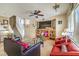 Living room with a large TV, comfortable seating, and a view of the staircase at 3448 Quiet Pueblo St, North Las Vegas, NV 89032