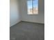 Bright bedroom featuring grey carpet and a large window at 353 Ukelele Pl # Lot 149, Henderson, NV 89015