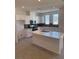 Spacious kitchen featuring white cabinets, quartz countertops, and an island at 353 Ukelele Pl # Lot 149, Henderson, NV 89015