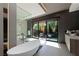 Bathroom features a soaking tub, walk-in shower, and private access to a patio at 3530 Cosima Ln, Las Vegas, NV 89120