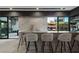 Modern bar with sleek countertops and outdoor access at 3530 Cosima Ln, Las Vegas, NV 89120