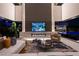 Spacious living room with fireplace and large TV at 3530 Cosima Ln, Las Vegas, NV 89120