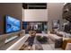Modern living room with a linear fireplace and outdoor access at 3530 Cosima Ln, Las Vegas, NV 89120