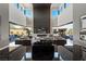 Open living space with a modern fireplace and large windows at 3530 Cosima Ln, Las Vegas, NV 89120