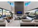 Spacious living room with modern fireplace and pool view at 3530 Cosima Ln, Las Vegas, NV 89120