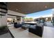 Covered patio with fire pit and comfortable seating at 3530 Cosima Ln, Las Vegas, NV 89120