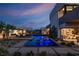 Stunning pool and patio area with modern lighting at dusk at 3530 Cosima Ln, Las Vegas, NV 89120