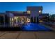 Luxury pool and patio at night with modern lighting at 3530 Cosima Ln, Las Vegas, NV 89120