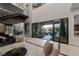 Living area with glass doors opening to a courtyard at 3530 Cosima Ln, Las Vegas, NV 89120
