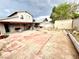 Backyard features a covered patio, tile, concrete perimeter, a storage shed, and block wall fence at 3620 Park Oliver Dr, Las Vegas, NV 89110