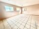 Bedroom with neutral walls, large windows, and tile flooring at 3620 Park Oliver Dr, Las Vegas, NV 89110