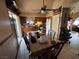 Kitchen with wood cabinets, dining table, and ceiling fan at 3620 Park Oliver Dr, Las Vegas, NV 89110
