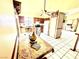 Eat-in kitchen featuring tile flooring, wood cabinets, and stainless steel appliances at 3620 Park Oliver Dr, Las Vegas, NV 89110