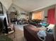 Living room with tiled floor, striped sofa, and TV at 3620 Park Oliver Dr, Las Vegas, NV 89110