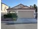 Charming single-story home featuring a well-maintained yard, tile roof, and attached two-car garage at 368 Legacy Dr, Henderson, NV 89014