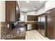 Modern kitchen with stainless steel appliances, granite countertops, and hardwood flooring at 368 Legacy Dr, Henderson, NV 89014