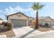 Single-story house with gray garage door and desert landscaping at 3902 Winter Whitetail St, Las Vegas, NV 89122