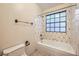 Bathroom with shower/tub combo and tile surround at 3954 Edgemoor Way, Las Vegas, NV 89121