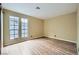 Bright bedroom with wood-look floors and large windows at 3954 Edgemoor Way, Las Vegas, NV 89121