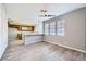Bright dining area with wood-look vinyl flooring and breakfast bar at 3954 Edgemoor Way, Las Vegas, NV 89121