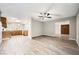 Open dining area with wood-look floors and kitchen access at 3954 Edgemoor Way, Las Vegas, NV 89121