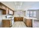 Cozy kitchen featuring wood cabinets, and modern flooring at 3954 Edgemoor Way, Las Vegas, NV 89121