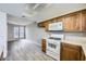 Kitchen with wood cabinets and a view into the dining area at 3954 Edgemoor Way, Las Vegas, NV 89121