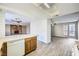 Open kitchen with breakfast bar, wood cabinets, and view of living room at 3954 Edgemoor Way, Las Vegas, NV 89121