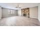 Spacious living room with hardwood floors and stone fireplace at 3954 Edgemoor Way, Las Vegas, NV 89121
