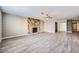 Bright living room with a stone fireplace and hardwood floors at 3954 Edgemoor Way, Las Vegas, NV 89121