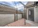 Small patio area with brick flooring and lattice at 3954 Edgemoor Way, Las Vegas, NV 89121