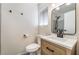 Modern bathroom with gray tile and updated fixtures at 421 Box Elder Way, Henderson, NV 89015