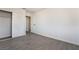 Bedroom with gray tile floor and sliding closet doors at 421 Box Elder Way, Henderson, NV 89015