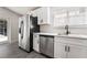 Stainless steel appliances and white cabinets in this updated kitchen at 421 Box Elder Way, Henderson, NV 89015