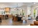 Bright dining area with a large table and wicker chairs, adjacent to the kitchen at 4386 Jerdon Ct, Las Vegas, NV 89129