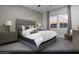 Main bedroom with a tufted headboard and large windows with mountain views at 4714 Tindra Ave # Lot 15, Las Vegas, NV 89121