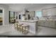 Modern kitchen with an island, white countertops, and gray cabinets at 4714 Tindra Ave # Lot 15, Las Vegas, NV 89121